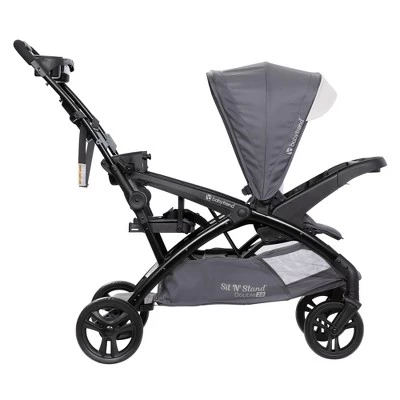 Baby Trend Sit N' Stand Double Stroller 2.0 DLX With 5 Point Safety Harness, Canopy, Extra Basket, 2 Cup Holders & Covered Compartment, Magnolia 4 Baby Trend Sit N' Stand Double Stroller 2.0 DLX With 5 Point Safety Harness, Canopy, Extra Basket, 2 Cup Holders & Covered Compartment, Magnolia - Image 2